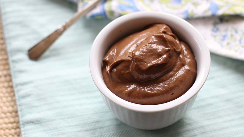 Avocado Chocolate Pudding is a Keto Sweet Treat - chocolate mousse on a table in a ramekin