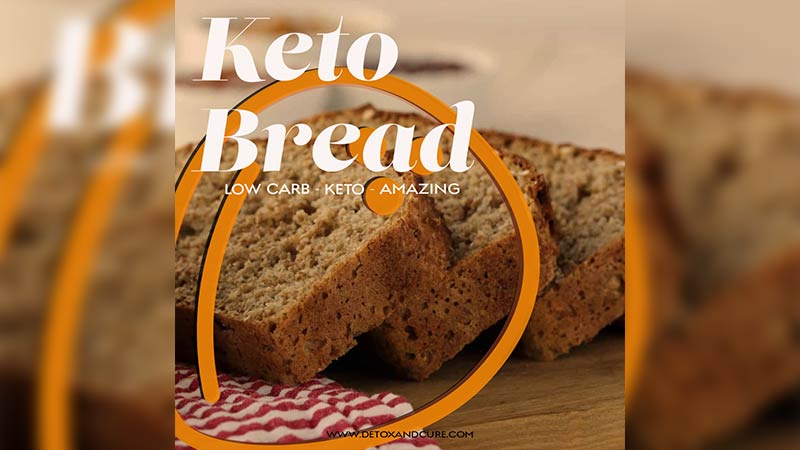 Perfect Ketosis Bread Recipe to keep you On Track. Slices of keto friendly bread diagonally laid upon each other on a timber chopping board with a red and white striped cloth to the left of them. This image is overlaid with the text "keto bread, low carb, keto, amazing' with a coconut icon to the left of the image.