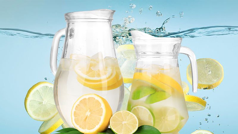 IS-ALKALINE-WATER-BETTER-FOR-YOU-THAN-REGULAR-WATER-lemon-water-and-a-splashing-image-of-lemons-in-water