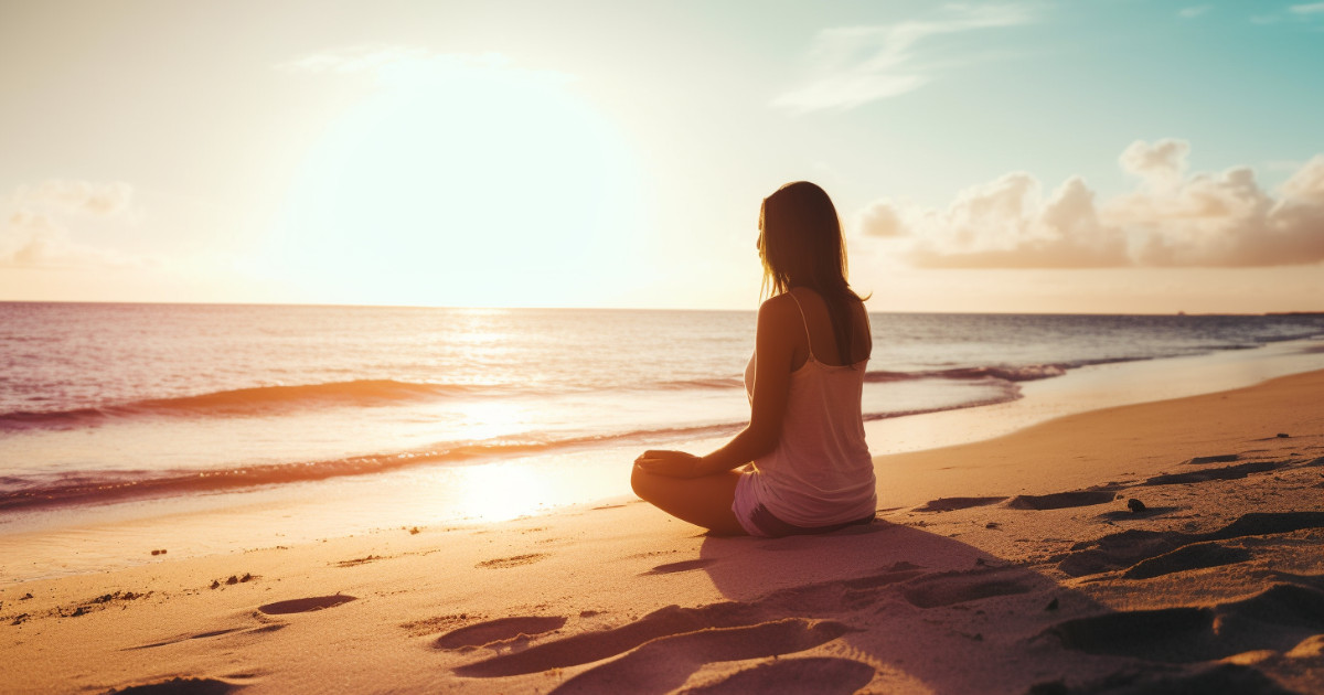 valerian essential oil side effects - a girl sitting on a beach having a meditation